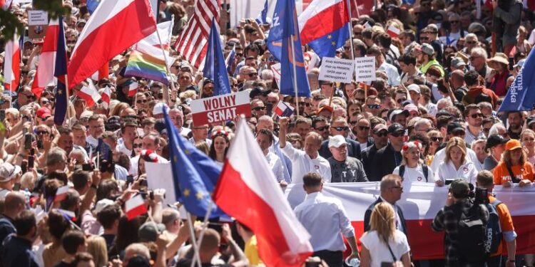 Poland’s opposition brings hundreds of thousands onto streets to protest against nationalist government | CNN
