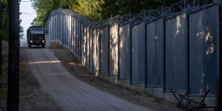 Poland plans to move around 10,000 troops to border with Belarus | CNN