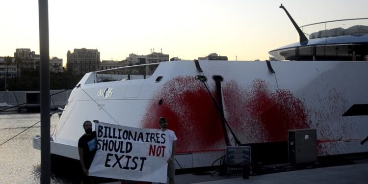 Activists spray red paint over billionaire Walmart heiress’s superyacht for a second time | CNN