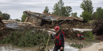 Boy rescued after spending the night clinging to a tree to escape deadly flooding in Spain | CNN