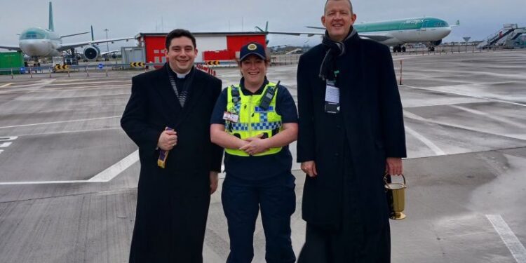 Airport falls silent as priest blesses planes | CNN